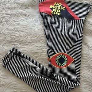 Niyama Sol Black and White Striped Womens Leggings with Red and Yellow Accents